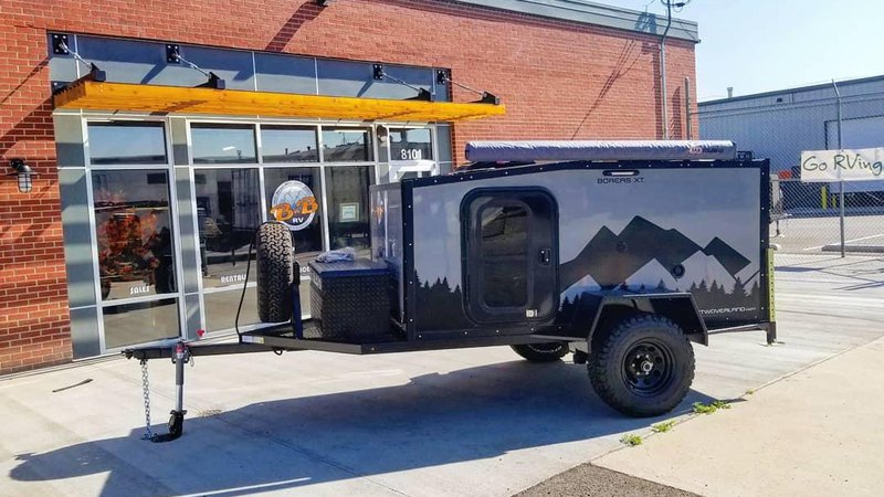 Our XT model overland camper in front of a dealer's door