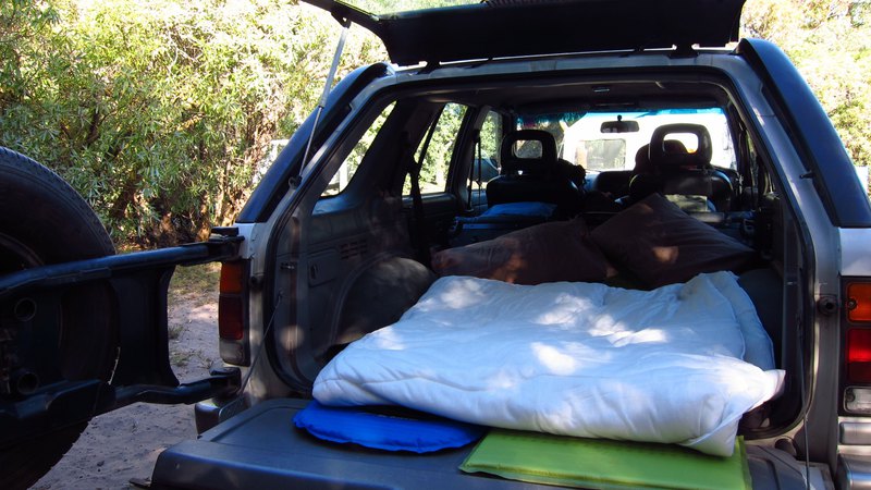 camp setup in back of offroad vehicle