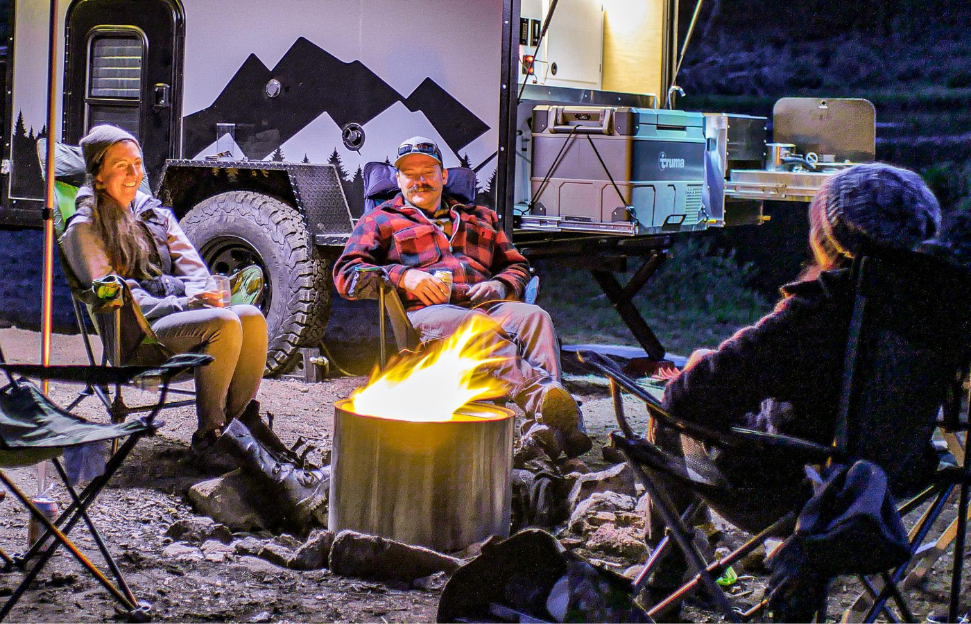 campers around a Solo Stove